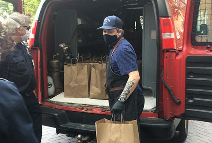 Chef Ryan McQuillan delivering EMS Lunches Donated by High Real Estate